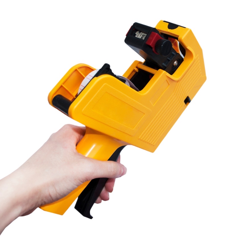 Як вставити папір у пістолет для цінників